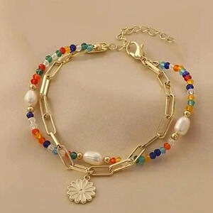 Gold Tone Two Strand Beaded Bracelet with adjustable length lobster clasp closur